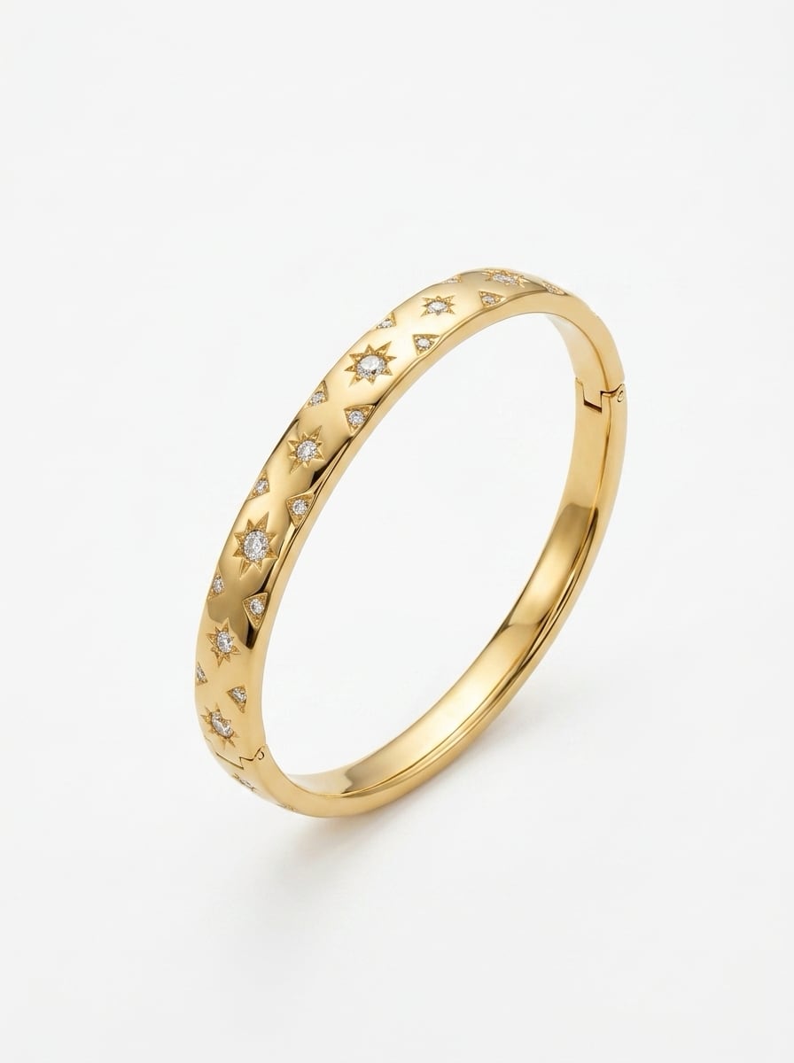 Gold ring with diamond accents on a white background