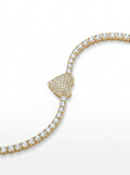 Gold bracelet with diamond accents on a white background