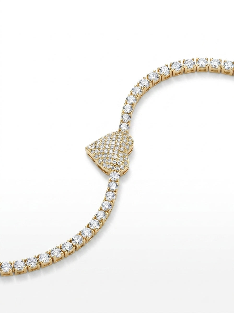 Gold bracelet with diamond accents on a white background